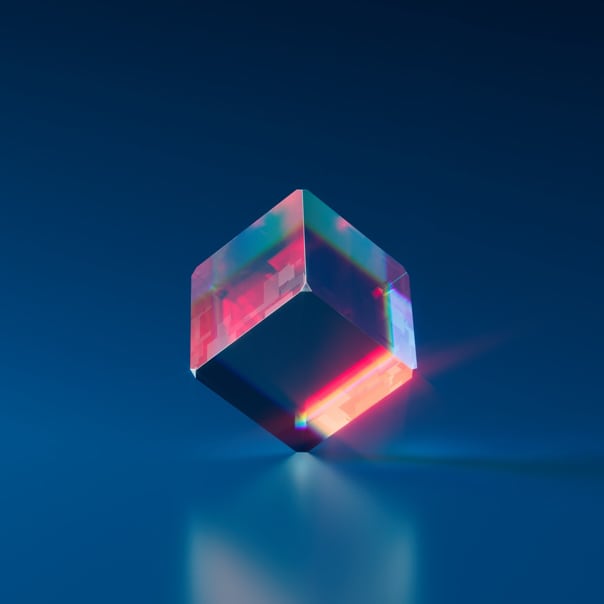 semi-translucent cube with shades of blue and red standing on one of its vertices